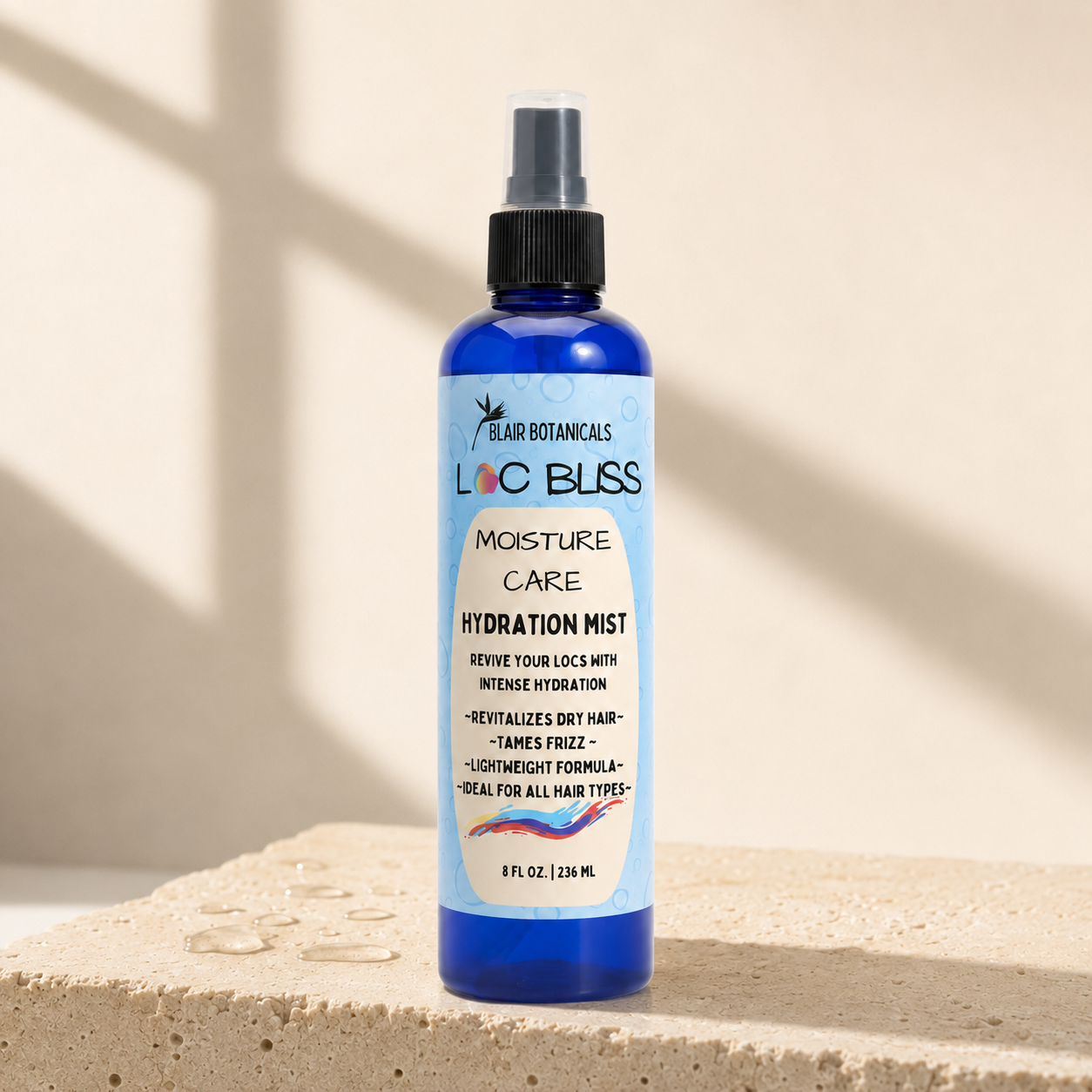 Blair Botanicals Loc Bliss 8 oz Hydration Mist bottle in warm natural light.